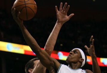 BOSTON - APRIL 20:  Rajon Rondo #9 of the Boston Celtics is fouled by Brad Miller #52 of the Chicago Bulls in Game Two of the Eastern Conference Quarterfinals during the 2009 NBA Playoffs at TD Banknorth Garden on April 20, 2009 in Boston, Massachusetts.  NOTE TO USER: User expressly acknowledges and agrees that, by downloading and or using this photograph, User is consenting to the terms and conditions of the Getty Images License Agreement. (Photo by Elsa/Getty Images)