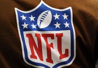 HOUSTON - OCTOBER 19:  An NFL Films photographer wears a brown vest with the NFL shield logo during play against the Detroit Lions and the Houston Texans at Reliant Stadium on October 19, 2008 in Houston, Texas.  (Photo by Ronald Martinez/Getty Images)