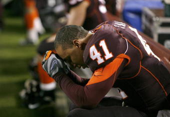 BLACKSBURG - OCTOBER 25:  Cam Martin #41 of the Virginia Tech Hokies hangs his head while he sits on the bench during the game against the Boston College Eagles at Lane Stadium on October 25, 2007 in Blacksburg, Virginia. (Photo by Kevin C. Cox/Getty Images)