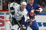 UNIONDALE, NY - APRIL 04: Ryan Malone #12 of the Tampa Bay Lightning in front of the net with Radek Martinek #24 of the New York Islanders in a National Hockey League game at Nassau Coliseum on April 4, 2009 in Uniondale, New York. (Photo by Paul Bereswill/Getty Images)