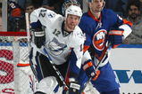 UNIONDALE, NY - APRIL 04: Ryan Malone #12 of the Tampa Bay Lightning in front of the net with Radek Martinek #24 of the New York Islanders in a National Hockey League game at Nassau Coliseum on April 4, 2009 in Uniondale, New York. (Photo by Paul Bereswill/Getty Images)