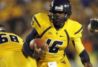 MORGANTOWN, WV - DECEMBER 1: Jarrett Brown #16 of the West Virginia Mountaineers carries the ball during the game against the Pittsburgh Panthers at Milan Puskar Stadium on December 1, 2007 in Morgantown, West Virginia. (Photo by Kevin C. Cox/Getty Images) 