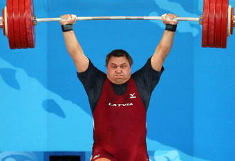 BEIJING - AUGUST 19:  Viktors Scebratihs of Latvia performs his final lift to win the bronze medal in the Men's 105 kg group weightlifting event at the Beijing University of Aeronautics & Astronautics Gymnasium on Day 11 of the Beijing 2008 Olympic Games on August 19, 2008 in Beijing, China.  (Photo by Julian Finney/Getty Images)