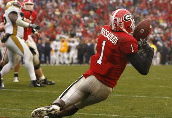 ATHENS, GA - NOVEMBER 29:  Wide receiver Mohamed Massaquoi #1 of the Georgia Bulldogs scores his third touchdown in the first half after briefly bobbling the pass during the game against the Georgia Tech Yellow Jackets at Sanford Stadium on November 29, 2008 in Athens, Georgia.  The Yellow Jackets beat the Bulldogs 45-42.  (Photo by Mike Zarrilli/Getty Images)
