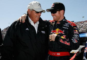 MARTINSVILLE, VA - MARCH 29:  Team Owner Rick Hendrick talks with Brian Vickers, driver of the #83 Red Bull Toyota, on the grid prior to the start of the NASCAR Sprint Cup Series Goody's Fast Pain Relief 500 at the Martinsville Speedway on March 29, 2009 in Martinsville, Virginia.  (Photo by Geoff Burke/Getty Images for NASCAR)