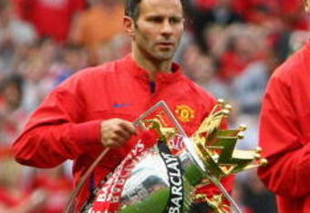MANCHESTER, UNITED KINGDOM - AUGUST 06:  Rio Ferdinand of Manchester United and team mate Ryan Giggs (L) show off the Premier League and Champions League trophies to their fans prior to the Pre Season Friendly match between Manchester United and Juventus at Old Trafford on August 6, 2008 in Manchester, England.  (Photo by Phil Cole/Getty Images)