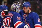 NEW YORK - APRIL 09: Henrik Lundqvist #30 of the New York Rangers is congratulated by Sean Avery #16 following a 2-1 defeat of the Philadelphia Flyers on April 9, 2009 at Madison Square Garden in New York City. The Rangers defeated the Flyers 2-1 to gain a playoff spot. (Photo by Bruce Bennett/Getty Images)