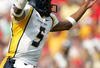 COLLEGE PARK, MD - SEPTEMBER 17:  Quarterback Pat White #5 of West Virginia celebrates after a touchdown during the second half of the game against Maryland on September 17, 2005 at Byrd Stadium in College Park, Maryland.  (Photo by Jamie Squire/Getty Images)