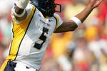 COLLEGE PARK, MD - SEPTEMBER 17:  Quarterback Pat White #5 of West Virginia celebrates after a touchdown during the second half of the game against Maryland on September 17, 2005 at Byrd Stadium in College Park, Maryland.  (Photo by Jamie Squire/Getty Images)