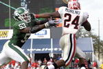 ORLANDO, FL - JANUARY 1: Running back Knowshon Moreno #24 of the University of Georgia rushes around linebacker Greg Jones #53 of the Michigan State Spartans at the 2009 Capital One Bowl at the Citrus Bowl on January 1, 2009 in Orlando, Florida.  (Photo by Al Messerschmidt/Getty Images) 