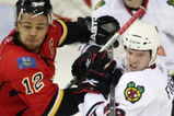 CALGARY, CANADA - APRIL 20: Jarome Iginla #12 of the Calgary Flames and Colin Fraser #46 of the Chicago Blackhawks battle for position during Game Three of the Western Conference Quarterfinals of the 2009 Stanley Cup Playoffs on April 20, 2009 at the Pengrowth Saddledome in Calgary, Alberta, Canada.  (Photo by Mike Ridewood/Getty Images)