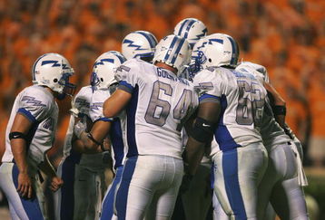 KNOXVILLE, TN - SEPTEMBER 9:    The Air Force Academy Falcons offense huddles just before scoring their final touchdown against the University of Tennessee Volunteers on September 9, 2006 at Neyland Stadium in Knoxville, Tennessee. Tennessee won 31-30.  (Photo by Stephen Dunn/Getty Images)