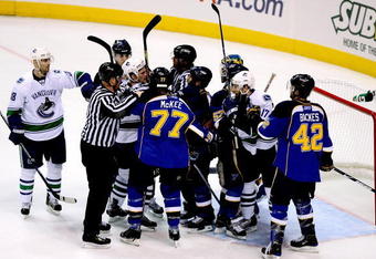 ST LOUIS, MO - APRIL 19:  Members of the St Louis Blues and the Vancouver Canucks fight in the first period during Game Three of the Western Conference Quarterfinal Round of the 2009 Stanley Cup Playoffs on April 19, 2009 at Scottrade Center in St. Louis, Missouri. (Photo by Matthew Stockman/Getty Images)