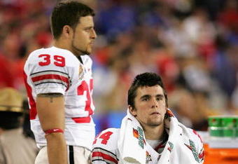 GLENDALE, AZ - JANUARY 08:  Michael Dougherty #39 and Grant Schwartz #24 of the Ohio State Buckeyes react during the finals seconds of the game before losing 41-14 to the Florida Gators during the 2007 Tostitos BCS National Championship Game at the University of Phoenix Stadium on January 8, 2007 in Glendale, Arizona.  The Gators defeated the Buckeyes 41-14.    (Photo by Doug Pensinger/Getty Images)
