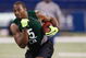 INDIANAPOLIS, IN - FEBRUARY 23:  Linebacker Aaron Curry of Wake Forset runs with the football during the NFL Scouting Combine presented by Under Armour at Lucas Oil Stadium on February 23, 2009 in Indianapolis, Indiana. (Photo by Scott Boehm/Getty Images)