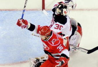 RALEIGH, NC - APRIL 21:  Jussi Jokinen #36 of the Carolina Hurricanes celebrates after scoring the game-winning goal against Martin Brodeur #30 of the New Jersey Devils during Game Four of the Eastern Conference Quarterfinals of the 2009 Stanley Cup Playoffs on April 21, 2009 at the RBC Center in Raleigh, North Carolina.  (Photo by Grant Halverson/Getty Images)