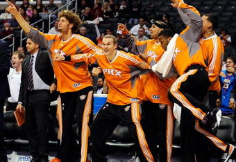 LOS ANGELES, CA - FEBRUARY 18:  Phoenix Suns bench celebrates as Shaquille O'Neal #32 of the Suns drives up the court after blocking Al Thornthon's #12 Los Angeles Clippers shot during the second quarter at the Staples Center February 18, 2009, in Los Angeles, California. NOTE TO USER: User expressly acknowledges and agrees that, by downloading and or using this photograph, User is consenting to the terms and conditions of the Getty Images License Agreement.  (Photo by Kevork Djansezian/Getty Images)