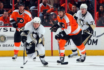 PHILADELPHIA - APRIL 21:  Ruslan Fedotenko #26 and Evgeni Malkin #71 of the Pittsburgh Penguins skate against Mike Richards #18 and Mike Knuble #22 of the Philadelphia Flyers during Game Four of the Eastern Conference Quarterfinal Round of the 2009 NHL Stanley Cup Playoffs  at the Wachovia Center on April 21, 2009 in Philadelphia, Pennsylvania. The Penguins defeated the Flyers 3-1 to take a three games to one lead in the series.  (Photo by Jim McIsaac/Getty Images)