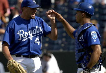 KANSAS CITY, MO - AUGUST 22:  Closer Jeremy Affeldt #48  (L) and catcher Alberto Castillo #45 of the Kansas City Royals celebrate their win over the Texas Rangers August 22, 2004 at Kauffman Stadium in Kansas City, Missouri. The Royals won 10-2 to end the Ranger's eight-game winning streak. (Photo by Dave Kaup/Getty Images)