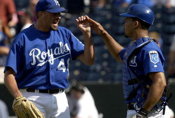 KANSAS CITY, MO - AUGUST 22:  Closer Jeremy Affeldt #48  (L) and catcher Alberto Castillo #45 of the Kansas City Royals celebrate their win over the Texas Rangers August 22, 2004 at Kauffman Stadium in Kansas City, Missouri. The Royals won 10-2 to end the Ranger's eight-game winning streak. (Photo by Dave Kaup/Getty Images)