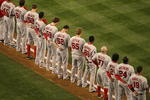 SEATTLE - APRIL 14:  Members of the Los Angeles Angels of Anaheim pause for a moment of silence honoring pitcher Nick Adenhart who was killed in a car crash last week, before the Seattle Mariners' Opening Day Major League Baseball game on April 14, 2009 at Safeco Field in Seattle, Washington. (Photo by Otto Greule Jr/Getty Images)