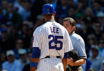 CHICAGO, IL - SEPTEMBER 18: First baseman Derrek Lee #25  of the Chicago Cubs argues with home plate umpire Ed Rapuano #19 after a called strike against the Milwaukee Brewers at the Wrigley Field on September 18, 2008 in Chicago, Illinois. (Photo by Scott Boehm/Getty Images)