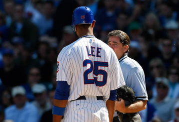 CHICAGO, IL - SEPTEMBER 18: First baseman Derrek Lee #25  of the Chicago Cubs argues with home plate umpire Ed Rapuano #19 after a called strike against the Milwaukee Brewers at the Wrigley Field on September 18, 2008 in Chicago, Illinois. (Photo by Scott Boehm/Getty Images)