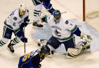ST. LOUIS, MO. - APRIL 21: Robert Luongo #1of the Vancouver Canucks makes a save against the St. Louis Blues during Game Four of the Western Conference Quarterfinals of the 2009 NHL Stanley Cup Playoffs at the Scottrade Center on April 21, 2009 in St. Louis, Missouri.  (Photo by Dilip Vishwanat/Getty Images)