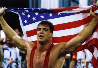 31 Jul 1996: Kurt Angle of the United States holds the American flag at the free-style wrestling competition during the Summer Olympics at the Georgia World Congress Center in Atlanta, Georgia.