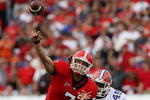 JACKSONVILLE, FL - NOVEMBER 01: Quarterback Matthew Stafford #7 of the Georgia Bulldogs throws a pass under pressure from defensive end Jermaine Cunningham #49 of the Florida Gators at Jacksonville Municipal Stadium on November 1, 2008 in Jacksonville, Florida.  (Photo by Doug Benc/Getty Images)