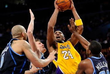 LOS ANGELES, CA - APRIL 21:  Kobe Bryant #24 of the Los Angeles Lakers goes up for a shot between Carlos Boozer #5, Andrei Kirilenko #47 and Paul Millsap #24 of the Utah Jazz in the fourth quarter of Game Two of the Western Conference Quarterfinals during the 2009 NBA Playoffs at Staples Center on April 21, 2009 in Los Angeles, California. NOTE TO USER: User expressly acknowledges and agrees that, by downloading and or using this photograph, User is consenting to the terms and conditions of the Getty Images License Agreement.  (Photo by Kevork Djansezian/Getty Images)