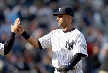 NEW YORK - APRIL 19:  Derek Jeter #2 of the New York Yankees celebrates with teammates after they beat the Cleveland Indians at Yankee Stadium on April 19, 2009 in the Bronx borough of New York City.  (Photo by Ezra Shaw/Getty Images)