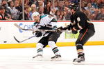ANAHEIM, CA - APRIL 21:  Dan Boyle #22 of the San Jose Sharks is checked by Bobby Ryan #9 of the Anaheim Ducks as he shoots the puck during Game Three of the Western Conference Quarterfinal Round of the 2009 Stanley Cup Playoffs at Honda Center on April 21, 2009 in Anaheim, California.  (Photo by Harry How/Getty Images)