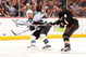 ANAHEIM, CA - APRIL 21: Dan Boyle #22 of the San Jose Sharks is checked by Bobby Ryan #9 of the Anaheim Ducks as he shoots the puck during Game Three of the Western Conference Quarterfinal Round of the 2009 Stanley Cup Playoffs at Honda Center on April 21, 2009 in Anaheim, California. (Photo by Harry How/Getty Images)