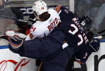 EDMONTON, CANADA - October 18: Dustin Boyd #16 of the Calgary Flames is checked by Steve MacIntyre #33 of the Edmonton Oilers during their NHL game on October 18, 2008 at Rexall Place in Edmonton, Alberta, Canada. (Photo by Dale MacMillan/Getty Images)