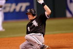 ST. PETERSBURG, FL - APRIL 16: Outfielder Brian Anderson #32 of the  Chicago White Sox slides into third base against the Tampa Bay Rays on April 16, 2009 at Tropicana Field in St. Petersburg, Florida.  (Photo by Al Messerschmidt/Getty Images)