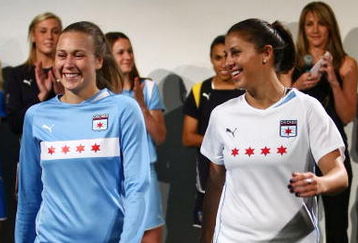 NEW YORK - FEBRUARY 24:  Nikki Krzysik (L) and Carli Lloyd unveil the Chicago Red Stripes team uniforms during a fashion show to unveil the new uniforms for the Women's Professional Soccer League February 24, 2009 in New York City, New York.  (Photo by Chris McGrath/Getty Images)