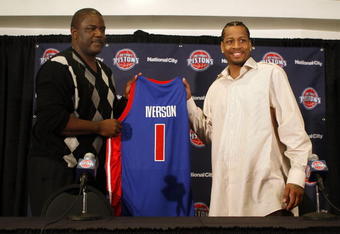 AUBURN HILLS, MI - NOVEMBER 04:  Allen Iverson #1 of the Detroit Pistons is introduced at press conference by President of Basketball Operations Joe Dumars after being traded from the Denver Nuggets on November 4, 2008 at the Palace of Auburn Hills in Auburn Hills, Michigan. NOTE TO USER: User expressly acknowledges and agrees that, by downloading and or using this photograph, User is consenting to the terms and conditions of the Getty Images License Agreement.  (Photo by Gregory Shamus/Getty Images)
