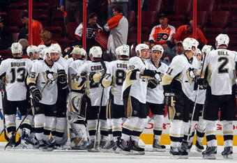 PHILADELPHIA - APRIL 21: The Pittsburgh Penguins celebrate after defeating the Philadelphia Flyers during Game Four of the Eastern Conference Quarterfinal Round of the 2009 NHL Stanley Cup Playoffs  at the Wachovia Center on April 21, 2009 in Philadelphia, Pennsylvania. The Penguins defeated the Flyers 3-1 to take a three games to one lead in the series.  (Photo by Jim McIsaac/Getty Images)