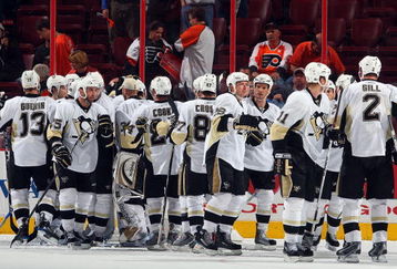PHILADELPHIA - APRIL 21: The Pittsburgh Penguins celebrate after defeating the Philadelphia Flyers during Game Four of the Eastern Conference Quarterfinal Round of the 2009 NHL Stanley Cup Playoffs  at the Wachovia Center on April 21, 2009 in Philadelphia, Pennsylvania. The Penguins defeated the Flyers 3-1 to take a three games to one lead in the series.  (Photo by Jim McIsaac/Getty Images)