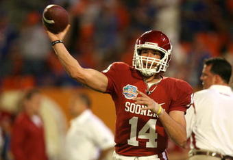 MIAMI - JANUARY 08:  Sam Bradford #14 of the Oklahoma Sooners warm-ups against the Florida Gators during the FedEx BCS National Championship game at Dolphin Stadium on January 8, 2009 in Miami, Florida.  (Photo by Doug Benc/Getty Images)