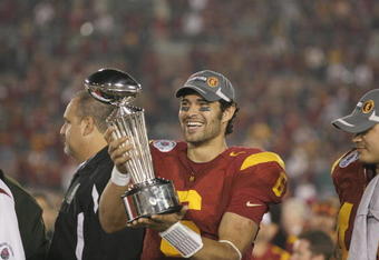 PASADENA, CA - JANUARY 1:  Mark Sanchez #6 of the USC Trojans smiles as he holds the Rose Bowl Trophy after the game against the Penn State Nittany Lions on January 1, 2009 at the Rose Bowl in Pasadena, California.  USC won 38-24.  (Photo by Jeff Golden/Getty Images)