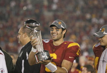 PASADENA, CA - JANUARY 1:  Mark Sanchez #6 of the USC Trojans smiles as he holds the Rose Bowl Trophy after the game against the Penn State Nittany Lions on January 1, 2009 at the Rose Bowl in Pasadena, California.  USC won 38-24.  (Photo by Jeff Golden/Getty Images)