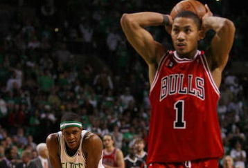 BOSTON - APRIL 18:  Rajon Rondo #9 of the Boston Celtics looks on as Derrick Rose #1 of the Chicago Bulls prepares to shoot a free throw in the final minute of overtime in Game One of the Eastern Conference Quarterfinals during the 2009 NBA Playoffs at TD Banknorth Garden on April 18, 2009 in Boston, Massachusetts. Rondo was called for fouling Rose. The Chicago Bulls defeated the Boston Celtics 105-103 in overtime. NOTE TO USER: User expressly acknowledges and agrees that, by downloading and or using this photograph, User is consenting to the terms and conditions of the Getty Images License Agreement. (Photo by Elsa/Getty Images)