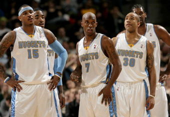DENVER - MARCH 05:  (L-R) J.R. Smith #1, Carmelo Anthony #15, Chauncey Billups #7, Dahntay Jones #30 and Nene #31 of the Denver Nuggets face the Portland Trail Blazers during NBA action at the Pepsi Center on March 5, 2009 in Denver, Colorado. The Nuggets defeated the Trail Blazers 106-90. NOTE TO USER: User expressly acknowledges and agrees that, by downloading and/or using this Photograph, user is consenting to the terms and conditions of the Getty Images License Agreement.  (Photo by Doug Pensinger/Getty Images)