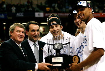 ATLANTA - MARCH 15:  (L-R) ACC Commissioner John Swofford presents the championship trophy to head coach Mike Krzyzewski, Greg Paulus #3, Jon Scheyer #30 and Gerald Henderson #15 of the Duke Blue Devils after their 79-69 win over the Florida State Seminoles in the championship game of the 2009 ACC Men's Basketball Tournament at the Georgia Dome March 15, 2009 in Atlanta, Georgia.  (Photo by Kevin C. Cox/Getty Images)