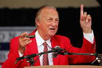 COOPERSTOWN, NY - JULY 31:  Stan Musial gets his harmonica ready to sing 'Take Me Out to the Ball Game' during the Baseball Hall of Fame induction ceremony on July 31, 2005 at the Clark Sports Complex in Cooperstown, New York.  (Photo by Ezra Shaw/Getty Images)