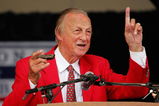COOPERSTOWN, NY - JULY 31:  Stan Musial gets his harmonica ready to sing 'Take Me Out to the Ball Game' during the Baseball Hall of Fame induction ceremony on July 31, 2005 at the Clark Sports Complex in Cooperstown, New York.  (Photo by Ezra Shaw/Getty Images)