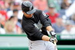 WASHINGTON - APRIL 19:  Cody Ross #12 of the Florida Marlins hits a single in the sixth inning against the Washington Nationals at Nationals Park on April 19, 2009 in Washington, DC.  (Photo by Greg Fiume/Getty Images)