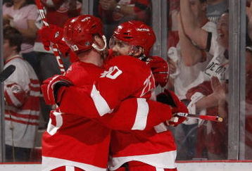 DETROIT - APRIL 18:  Henrik Zetterberg #40 of the Detroit Red Wings celebrates a second period gaol with Johan Franzen #93 while playiny the Columbus Blue Jackets during Game Two of the Western Conference Quarterfinals of the 2009 NHL Stanley Cup Playoffs on April 18, 2009 at Joe Louis Arena in Detroit, Michigan.  (Photo by Gregory Shamus/Getty Images)